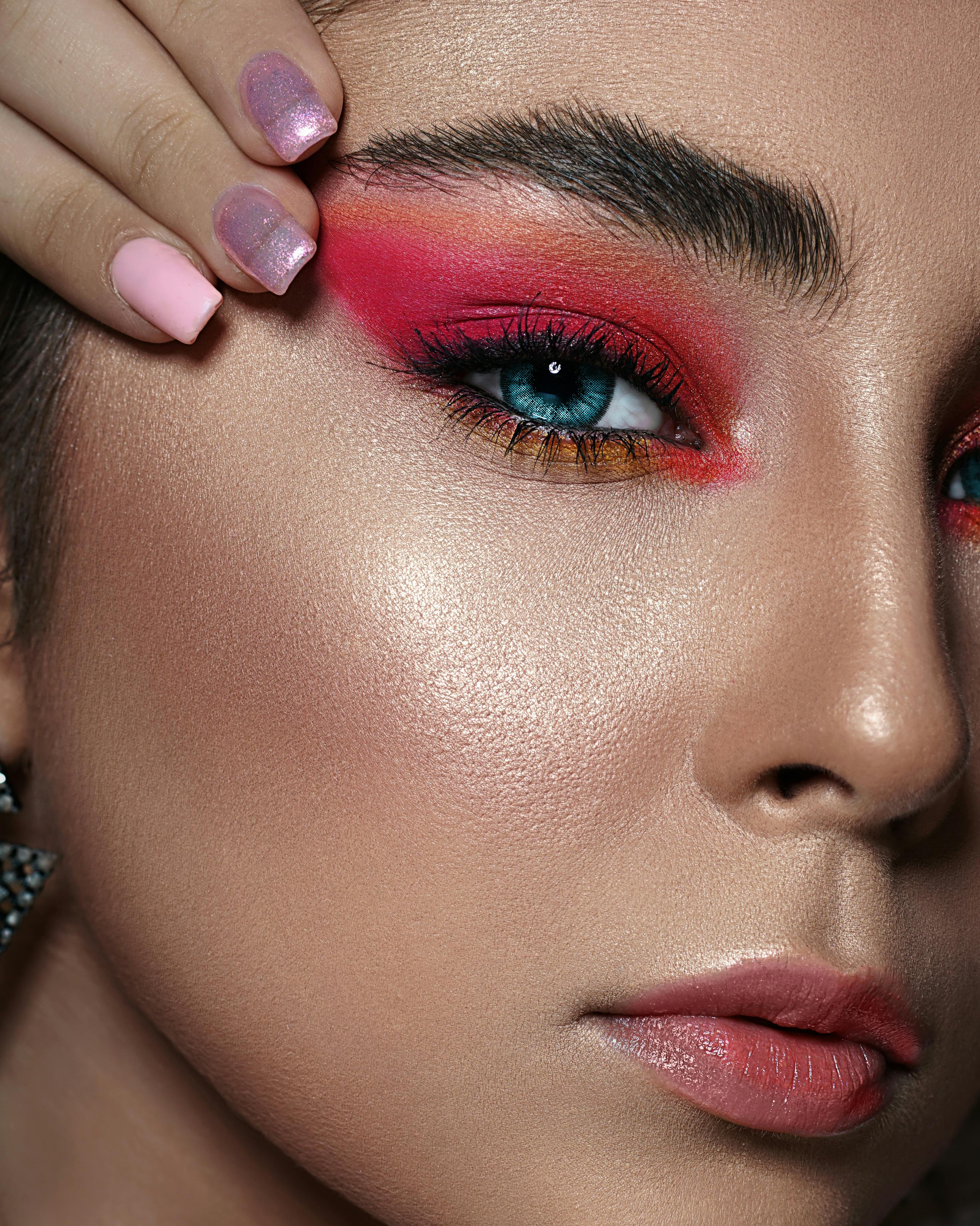 A close-up image of a vibrant and shimmery 80s-inspired eyeshadow palette with bold colors and metallic finishes, showcasing the retro glam aesthetic of Marimor Beauty's makeup collection.