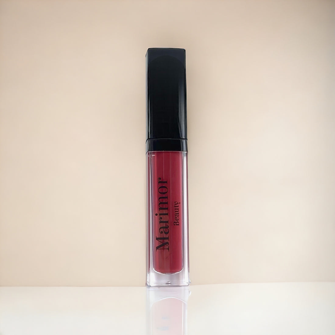 Purple pink lipstick from Marimor Beauty on a white background with a subtle shimmer effect.