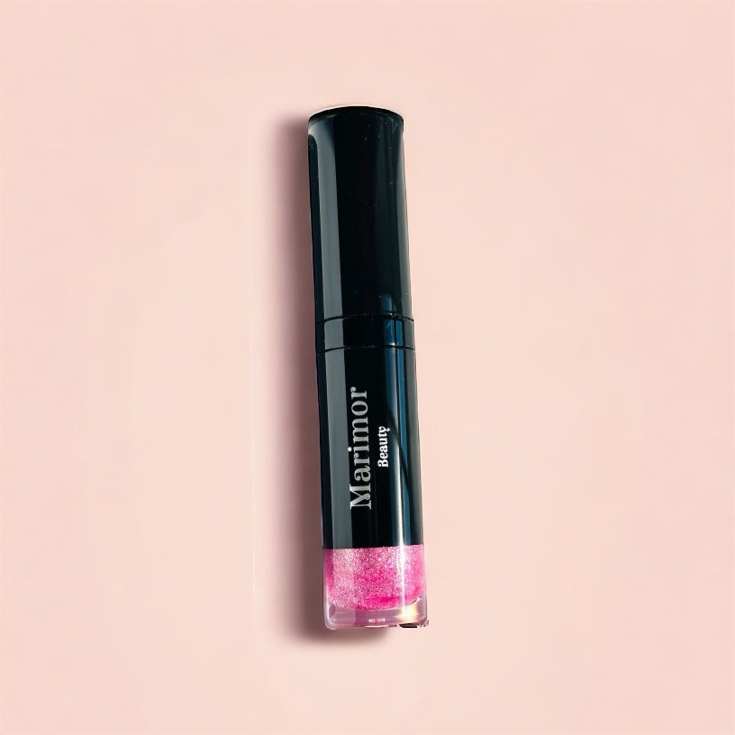 A woman's lips with a glossy finish, showcasing a natural and radiant glow.