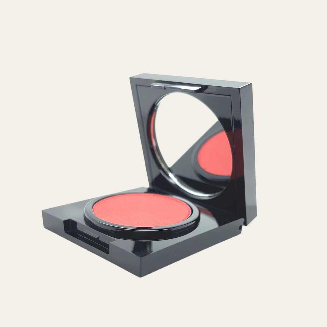 Cream blush in a sleek, black packaging with a soft, rosy hue.